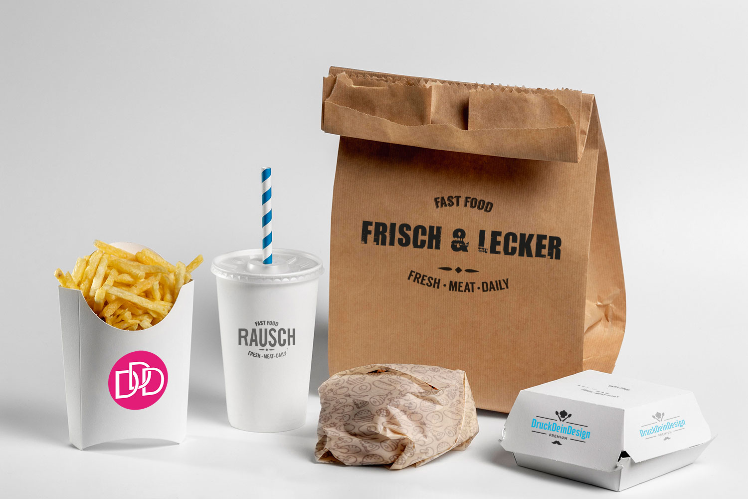 Verschiedene personalisierte Fast Food verpackungen und eine Pommesschale mit dem Druck Dein Design Logo